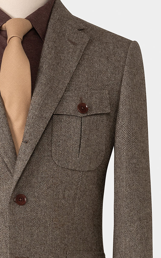 Brown herringbone pattern detail on bespoke wool blazer