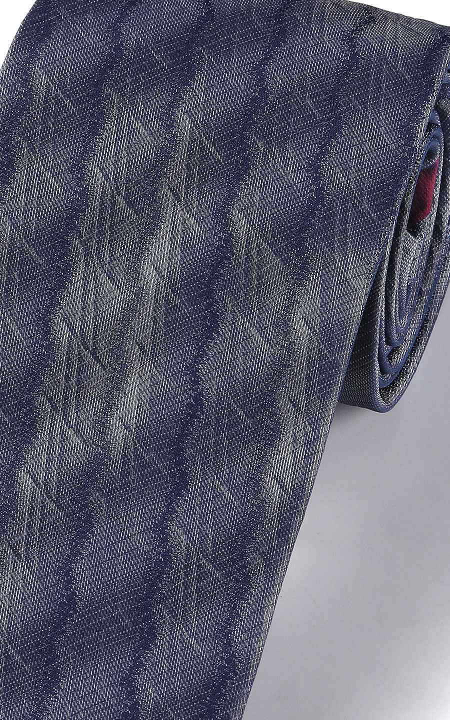 Close-up of navy blue plaid pattern on silk business tie
