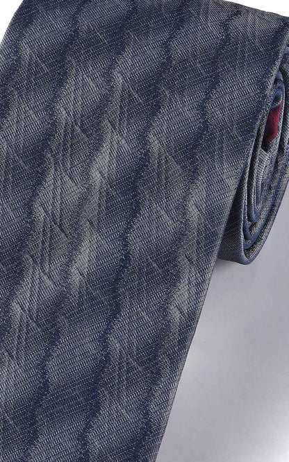 Close-up of navy blue plaid pattern on silk business tie
