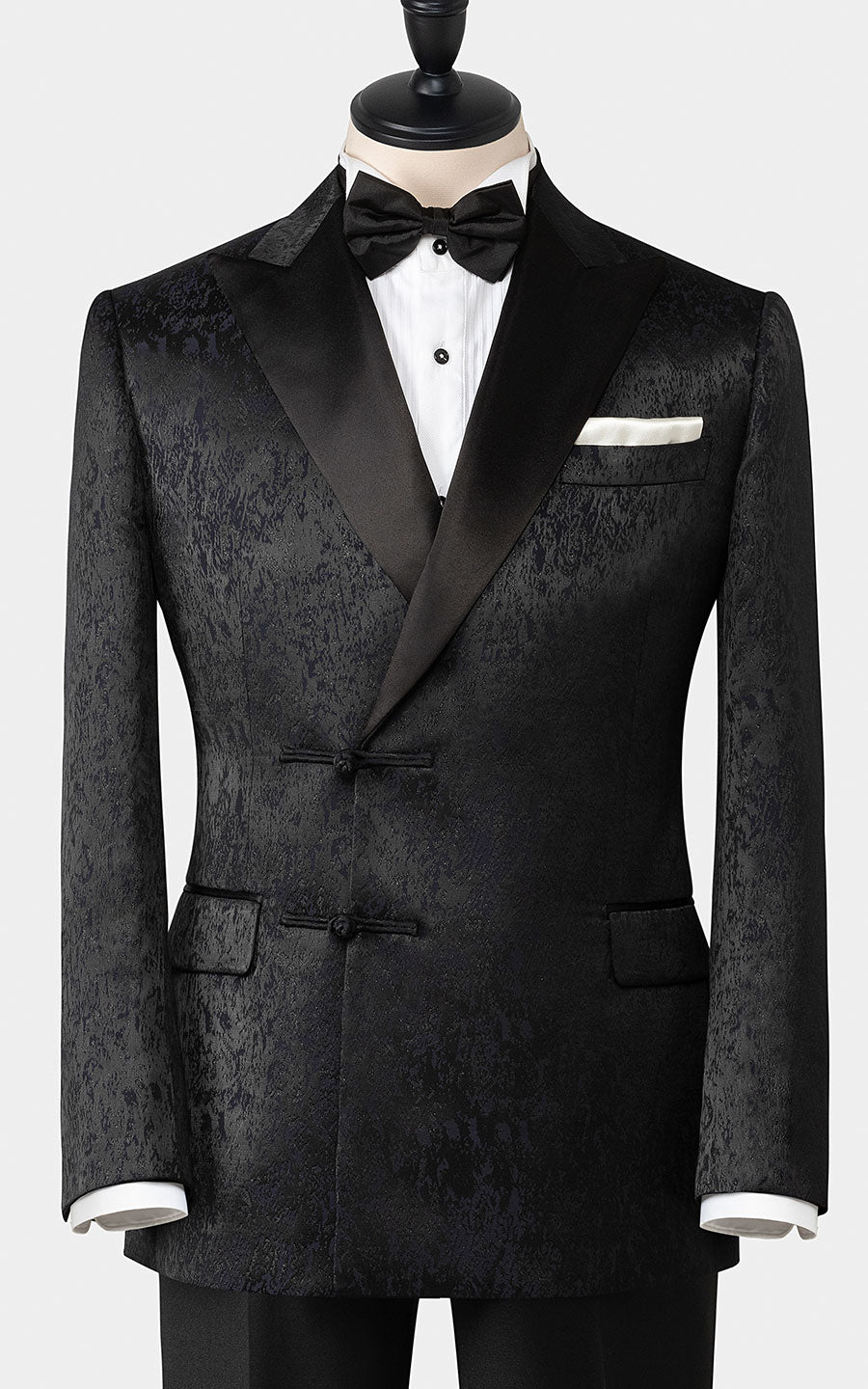Man wearing black jacquard Chinese custom formal tuxedo