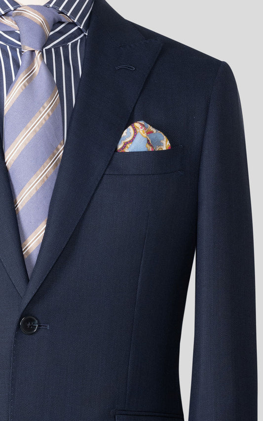 Navy blue textured bespoke suit fabric close up detail