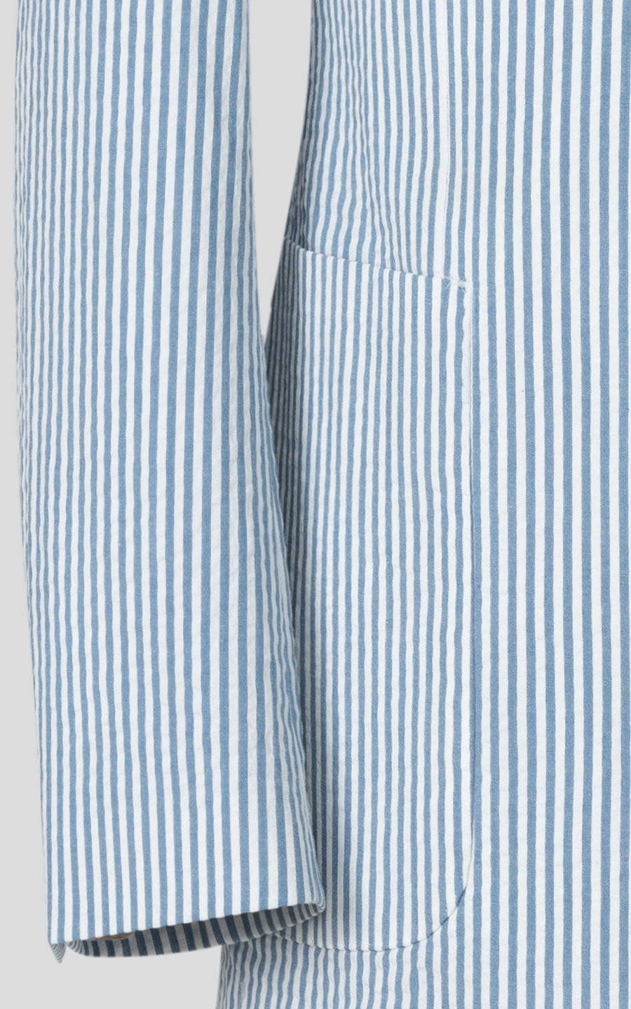 Light blue striped seersucker suit fabric close up