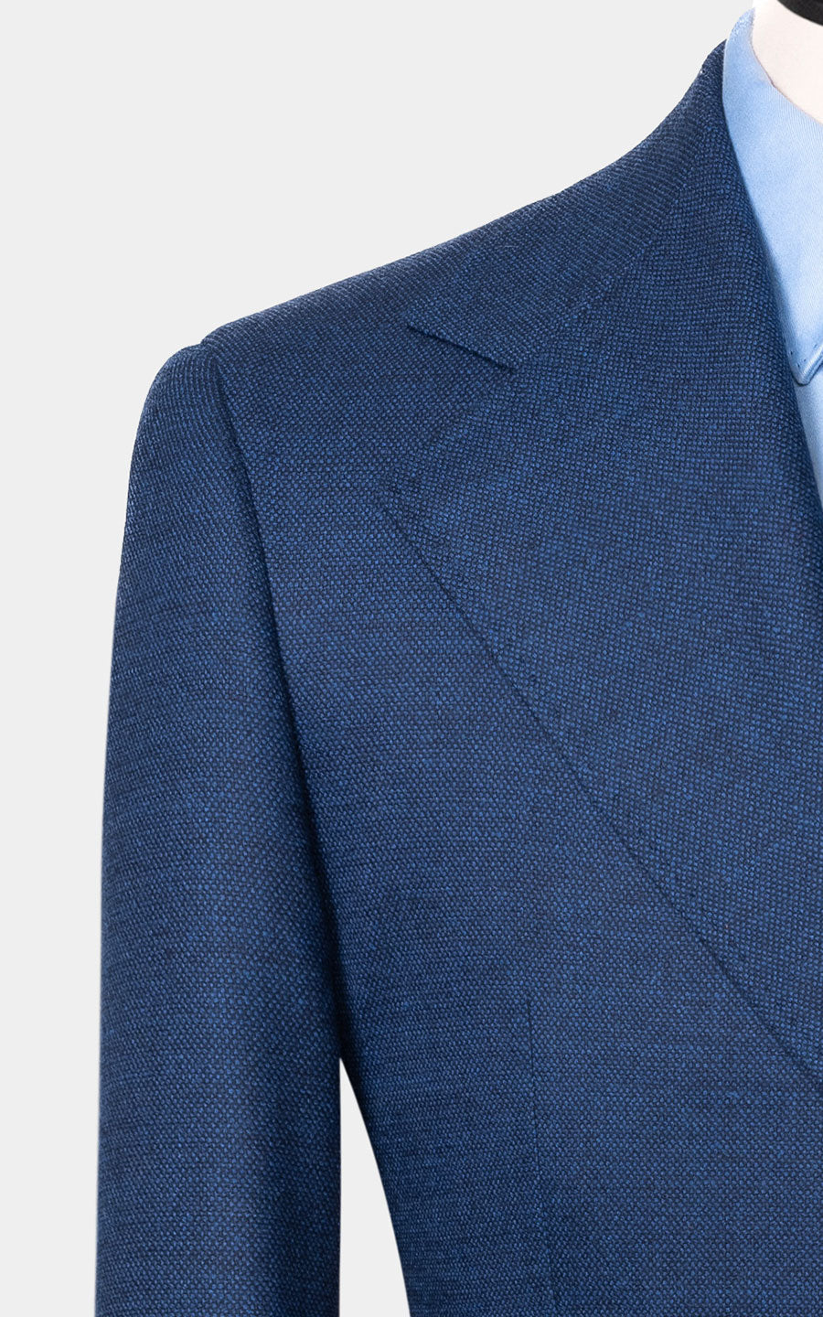 Blue birdseye weave pattern suit fabric close up