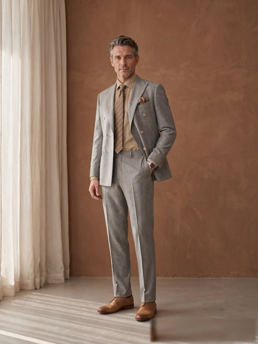 Mature model wearing a tailored grey Guabello wool double-breasted suit - front view