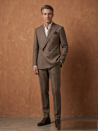 Mature model wearing a tailored brown plaid Guabello wool double-breasted suit - front view